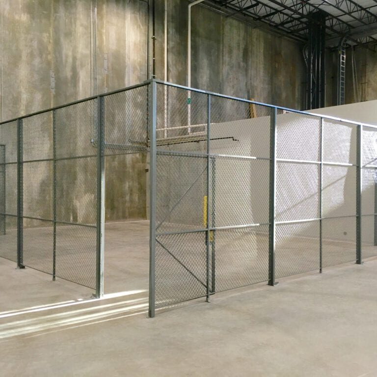 A room with glass walls and metal bars.