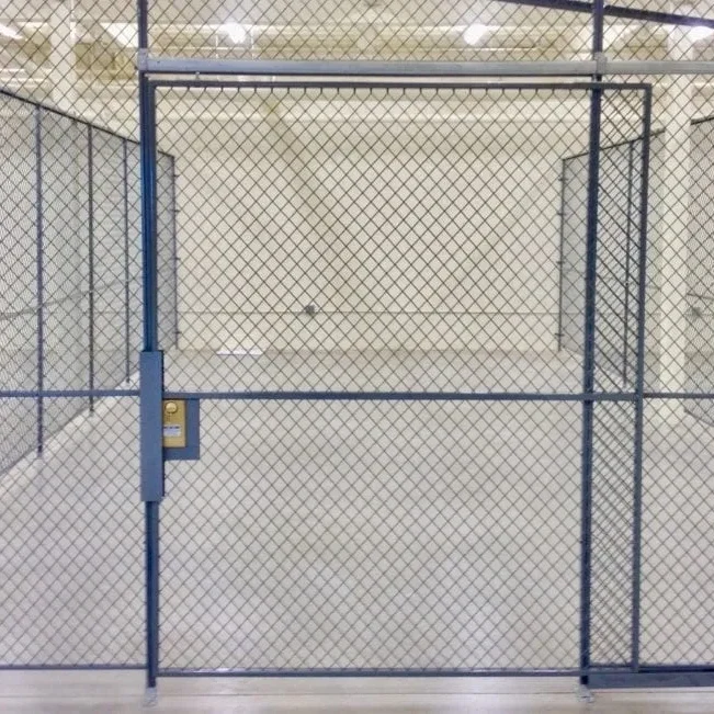 A chain link fence with two gates open.